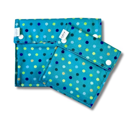 Two teal reusable bags with a dot pattern on a white background
