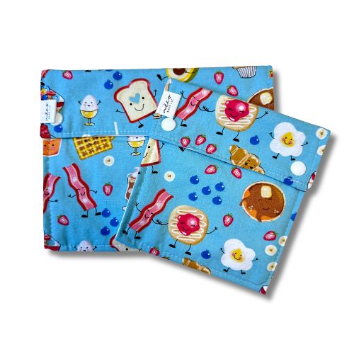 Two reusable bags with a breakfast-themed design on a white background
