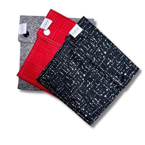 grey red and black three fabric bags with snaps