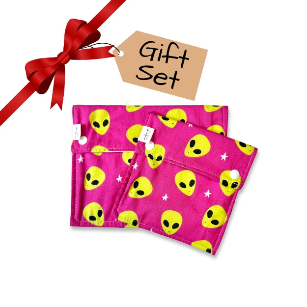 Pink snack bags with yellow alien pattern and red ribbon on a white background