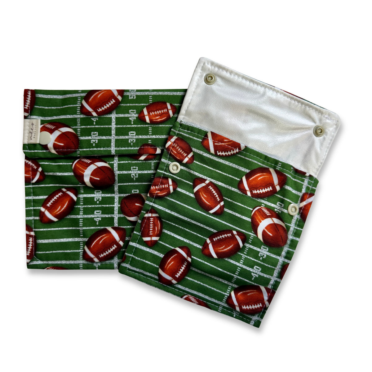 Two snack and sandwich bags  shown on a white background. The pouches have a green background with a footballs and football field markings. Cute fun, and colorful machine washable food bags