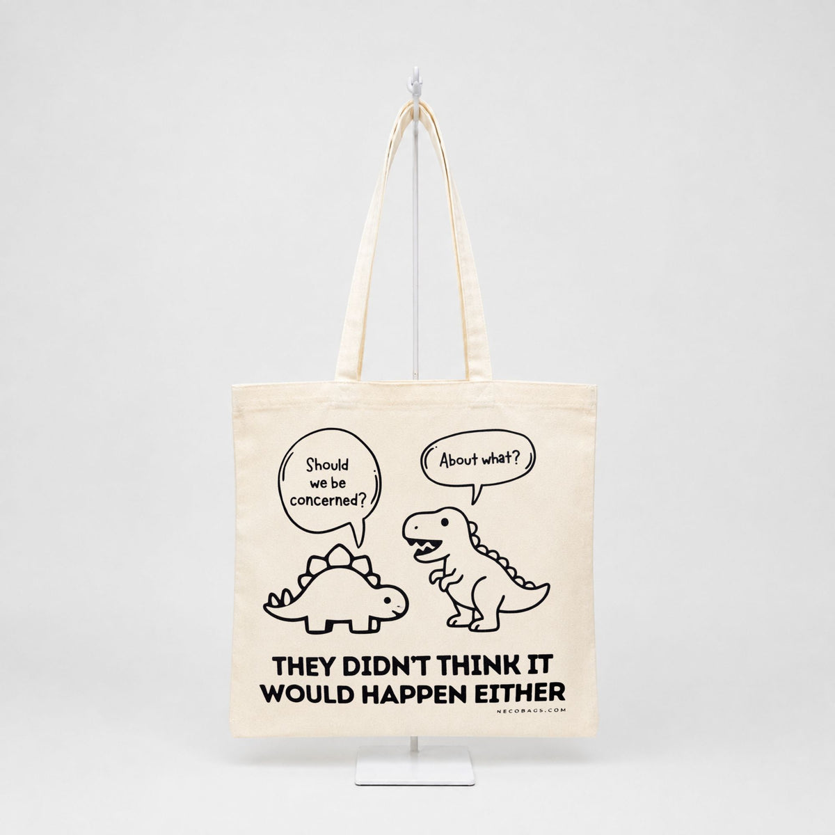 Funny dinosaur canvas tote bag with They Didn't Think It Would Happen Either graphic