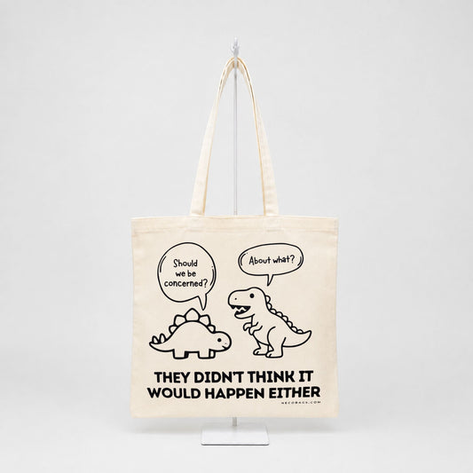 Funny dinosaur canvas tote bag with They Didn't Think It Would Happen Either graphic