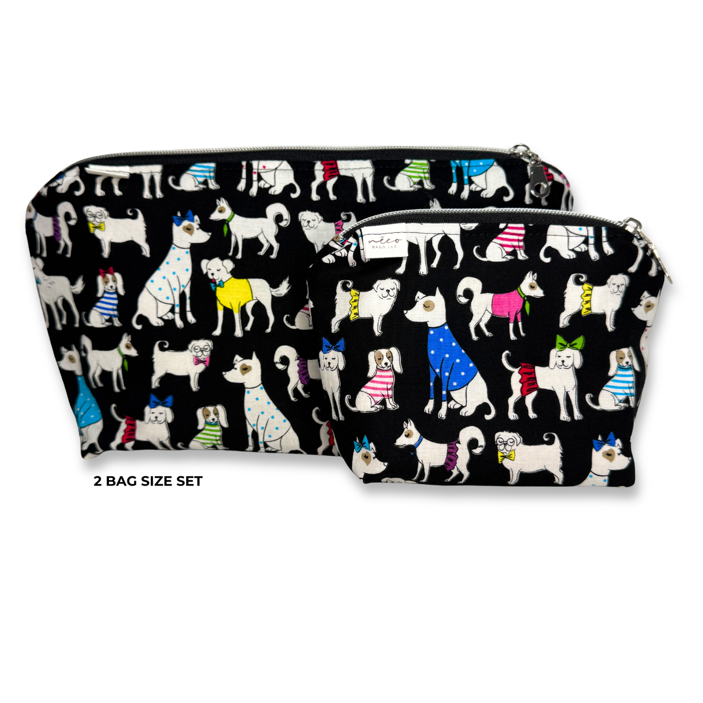 Two zippered cosmetic bags with a black background and a colorful pattern of cartoon dogs wearing sweaters, shown on a white background with the text '2 BAG SIZE SET'. Machine Washable Cosmetic Bags