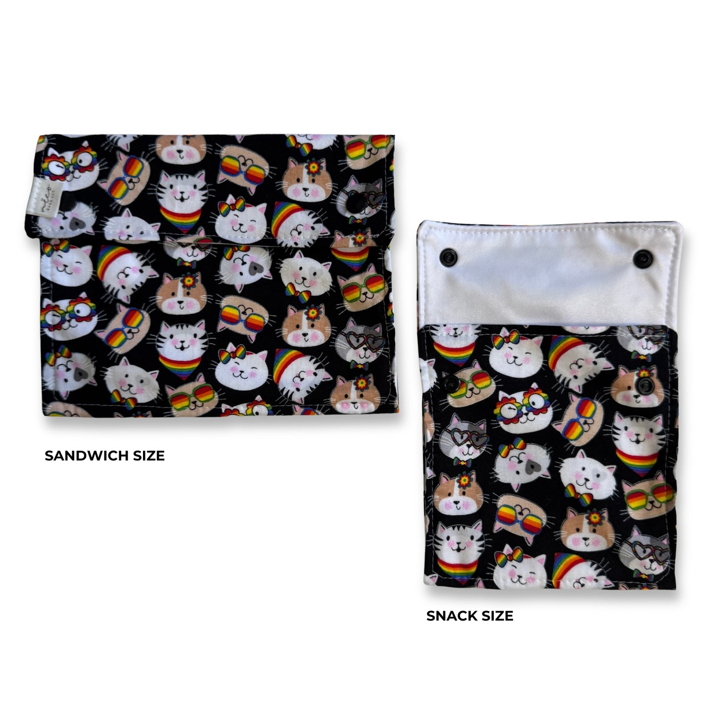 Two fabric snack pouches shown on a white background, labeled SANDWICH SIZE and SNACK SIZE. Both have a black background with a repeating print of white cats wearing rainbow sunglasses and hats. machine washable snack and sandwich bag sets