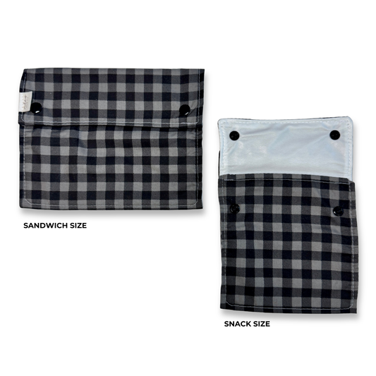 Two snack and sandwich bags  shown on a white background, labeled Sandwich Size and Snack Size. The pouches have a a black and dark grey checkered pattern. Cute fun, and colorful machine washable food bags