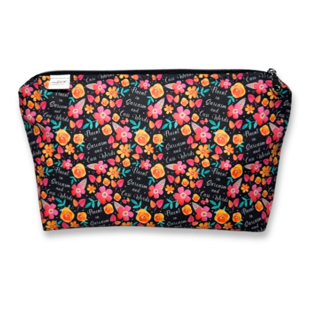 Floral patterned pouch with colorful flowers and text on a black background