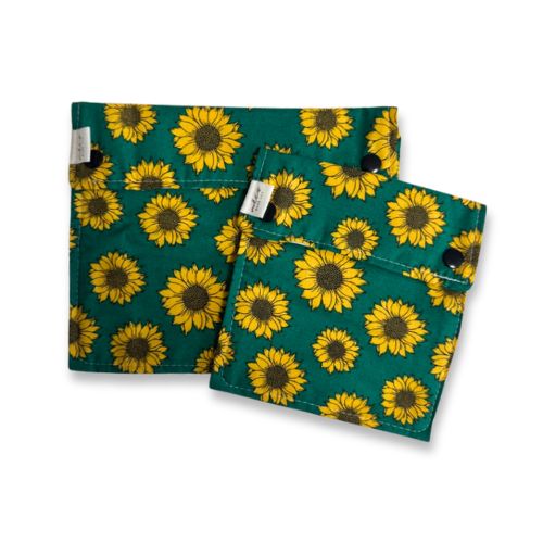 Two green fabric pouches with sunflower pattern on a white background