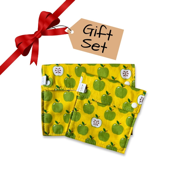 Yellow fabric with green apple pattern, red ribbon, and 'Gift Set' tag on white background