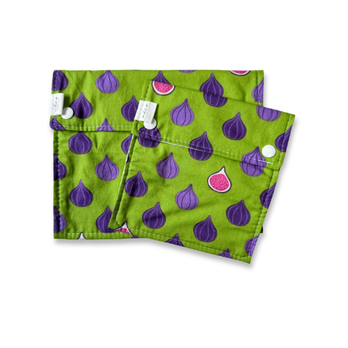 Green snack bags with purple and pink fig pattern on a white background