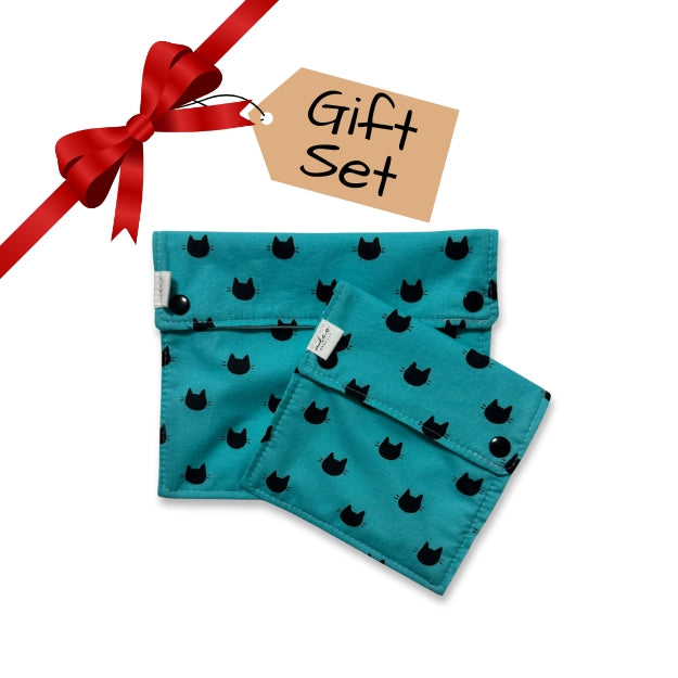 snack bags Teal fabric with black cat pattern, tied with a red ribbon and 'Gift Set' tag on white background