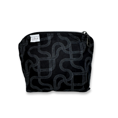 Black pouch with white geometric pattern on a white background